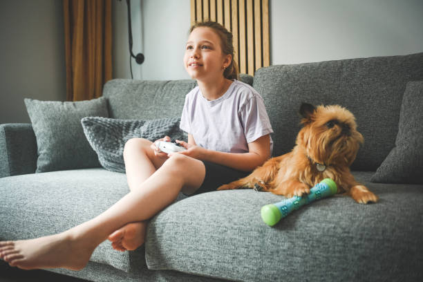 istock teenage girl playing computer games 2160928067