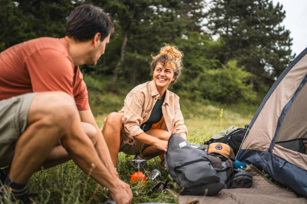 istock Couple pack equipment and theirs backpack after finish camp trip 2160929827