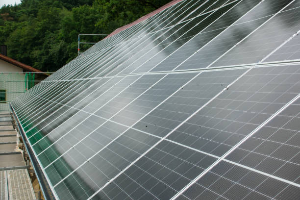 istock Black solar panels on a red tile roof 2160930253