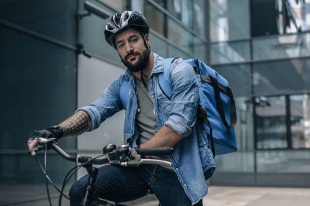 istock Cyclist Riding Through Urban Area in the Evening 2160933452