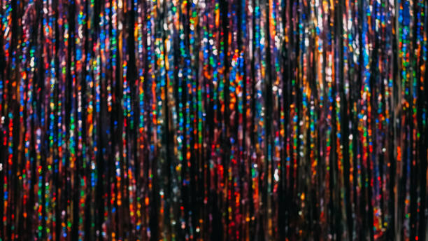 Festive tinsel texture bokeh light blur background