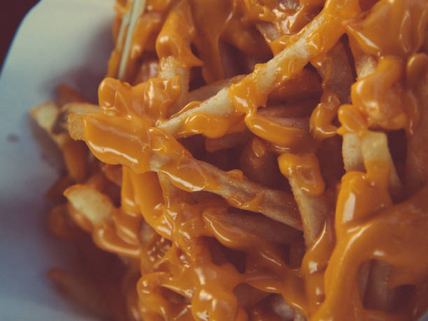 Close-Up Of Shredded Cheese On Food