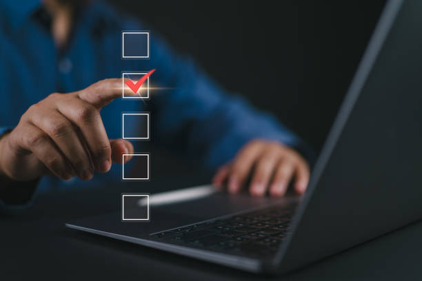 istock Checklist concept. Businessman using laptop tick correct mark in checkbox on virtual screen. 2160941686