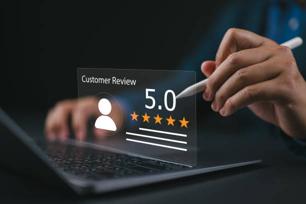 istock Businessman using laptop give rating to service experience on online application, 5-star satisfaction, satisfaction feedback review, good quality most. 2160941690