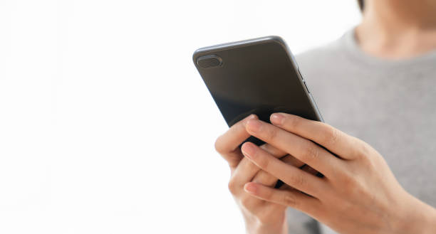 istock Woman holding a smartphone and using social media on internet. 2160946032