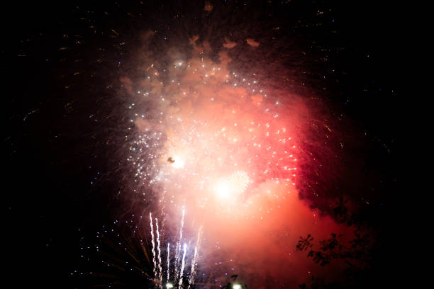 istock Hazy fireworks finale in the night sky 2160953663