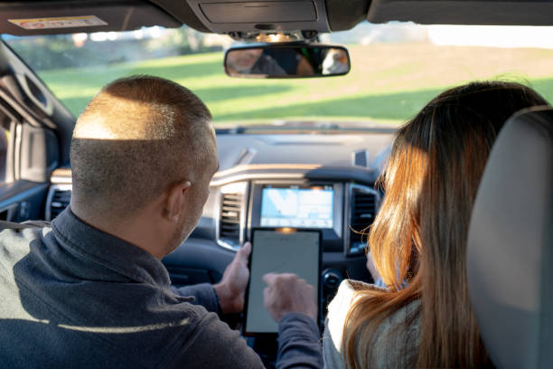 istock Driving Instuctor Shows Results of Test on Tablet 2160953938
