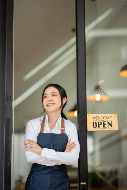 istock Female employee working at a cafe 2160954302