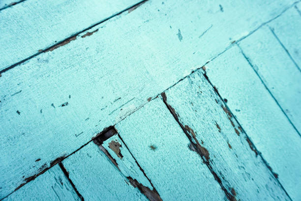 Detail texture of cracked light blue wooden table top. Empty blank copy text space.