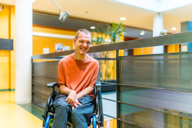 istock Happy man with cerebral palsy in a modern coworking 2160956637