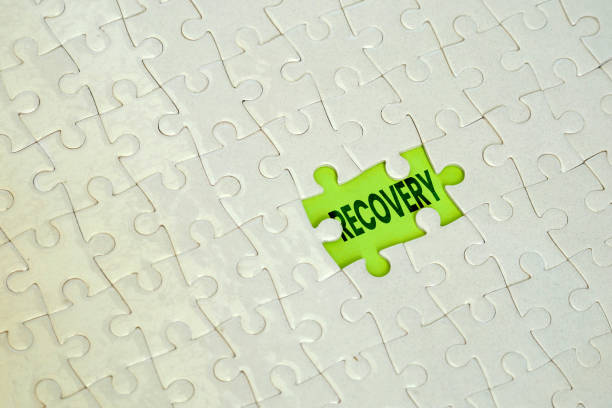 istock the word recovery behind the jigsaw puzzle pieces 2160958206