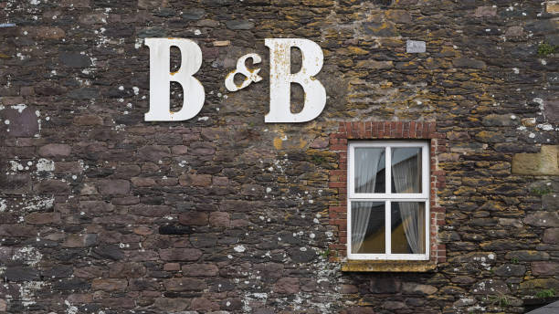 istock Bed and Breakfast Sign on a Stone Building with Copy Space 2160960700