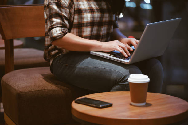 istock Asian schoolgirl in casual clothes, doing homework and using technology laptops in cafes, back to school 2160965018