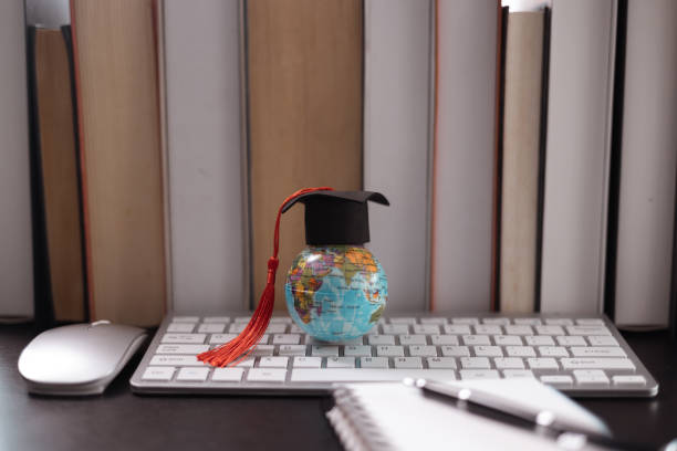 istock Graduate, diploma in global business, reflected on academic journey, which began as student studying diligently at college, ready to make an impact on earth. degree, graduation, abroad, book, hat. 2160965923