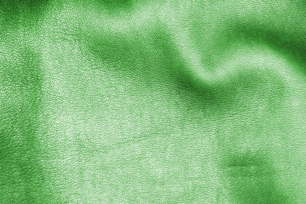 Brown leather texture background with red ribbon.