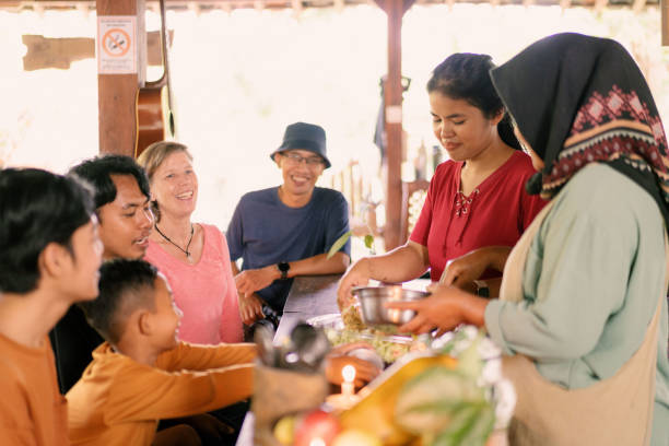 istock Group of Diverse People Having Fun Preparing Meals Together in a Real Kitchen 2160970108