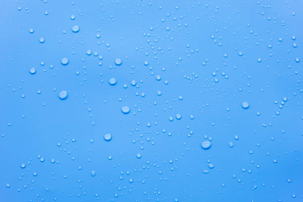 istock Water or rain drops on blue background 2160970280
