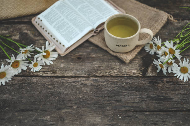 istock Cup with the inscription blessed and open Bible, Christian concept 2160971693