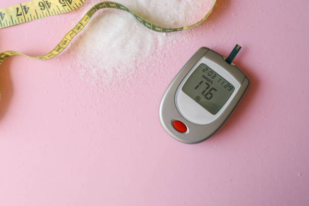istock Sugar level measuring tool and measuring tape on table, weight loss concept 2160972577
