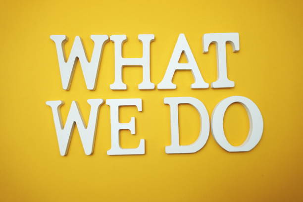 istock What we do alphabet letter on yellow background 2160972936