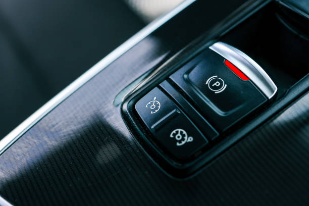 Electronic handbrake button. Gear shift stick into P position, (parking) symbol in automatic transmission car. Modern automatic gearbox car. Car detailing. Interior car inside. handle closeup.