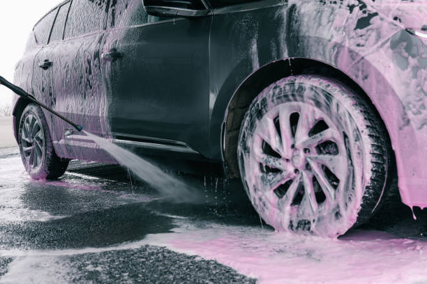 istock Hand washing car with pink foam, advertising 2160973313