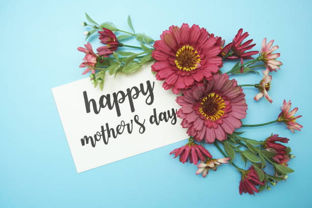 istock Happy Mother's Day typography text with daisy flowers on blue background 2160973337