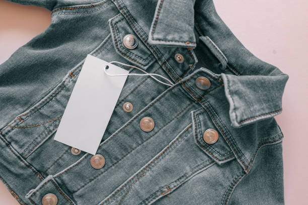 istock Children's denim jacket on a pink background 2160973838