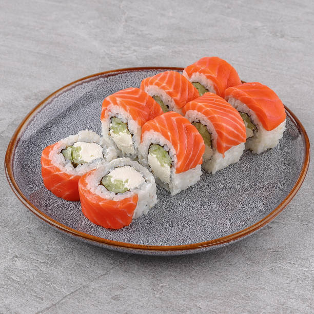 istock delicious rolls with salmon on a white background studio shooting 1 2160976515