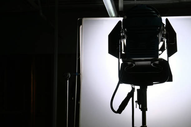 istock Silhouette of a professional studio lighting equipment on the stage. 2160985631