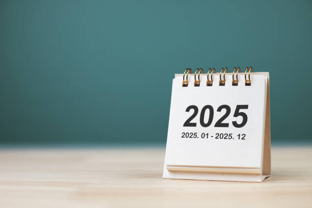 istock Small 2025 year calendar on desk with copy space. 2160987582