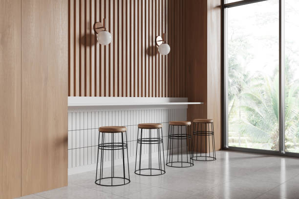 istock Wooden cafe interior with chairs and table in row, dining space near window 2160988306