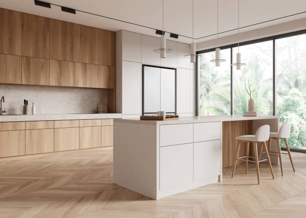 istock Modern kitchen with wooden and white cabinets, bright and spacious interior, large windows with a lush green view, minimalist design, contemporary home decor, daytime.  3D Rendering 2160988916