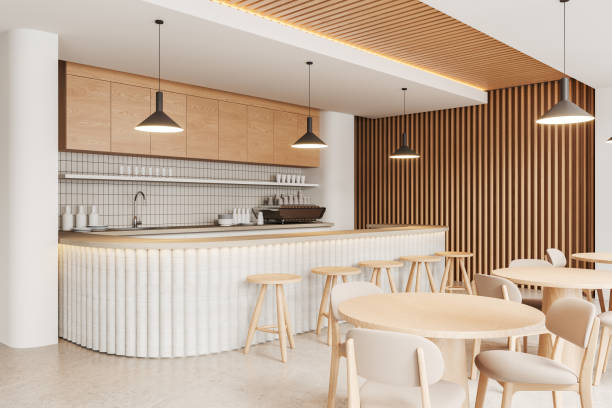istock Stylish cafe interior with bar island and dining tables with chairs in row 2160989041