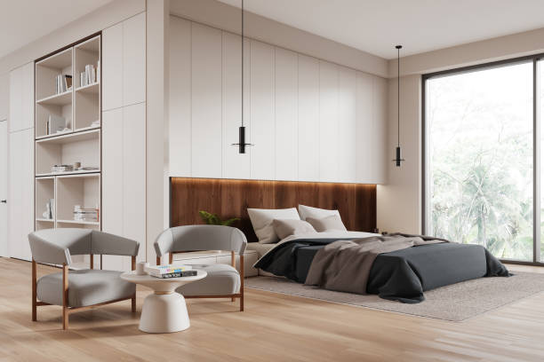 istock Cozy home bedroom interior with bed, armchairs and panoramic window 2160989087