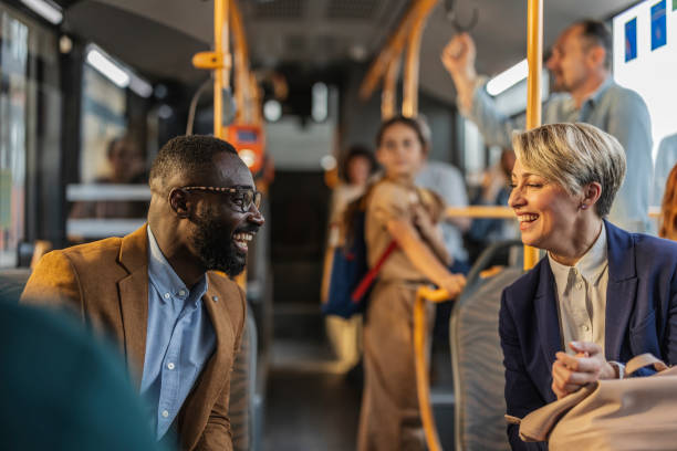 istock Professionals Laughing Together on Public Transit 2160989359