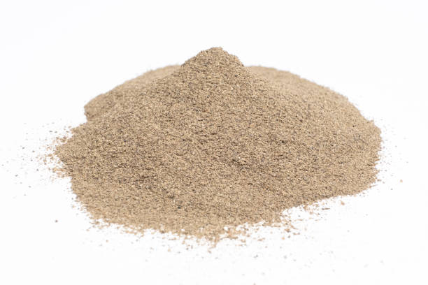 istock Spilled ground black pepper spicy seasoning on a white background 2160990233