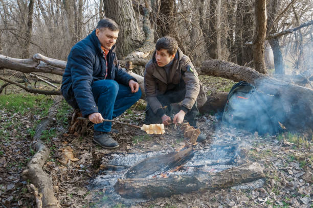 Handsome Male Preparing Barbecue and Drink Beer on Family Picnic