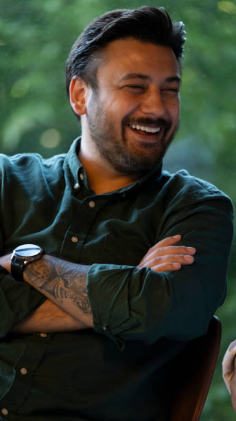 istock A middle-aged slightly overweight man posing in stylish office clothes in a nice cafe 2160991924