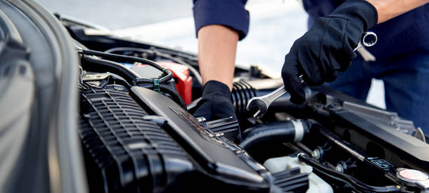 istock Professional mechanic working on the engine , repairing a car engine automotive workshop with a wrench, car service and maintenance,Repair service. 2160992004