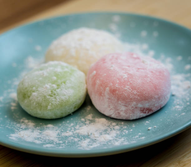 istock Different color delicious Japanese mochi on the blue plate 2160992989