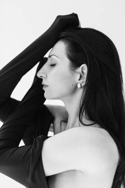 istock Brunette woman in dress in studio. Femininity 2160993522