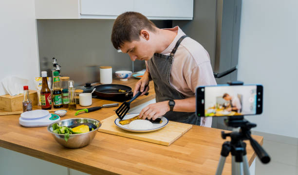 istock The chef is broadcasting live from workshop how to prepare a grilled eggplants with garlic 2160993594