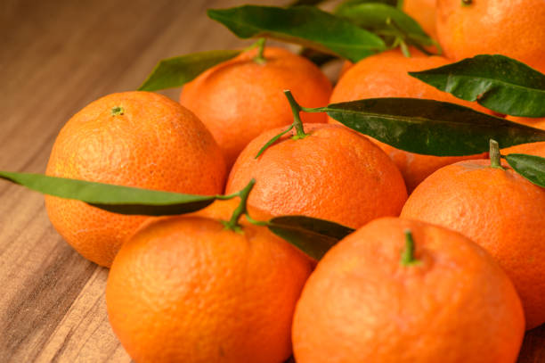 istock fresh juicy tangerines on a wooden table 12 2160994020