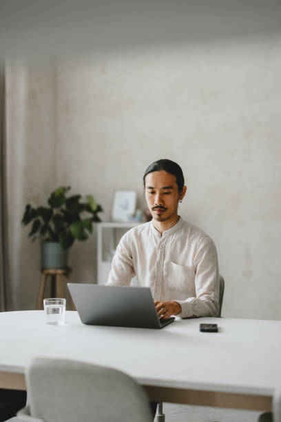 istock Focused Businessman Working at Laptop in Modern Office 2160994943
