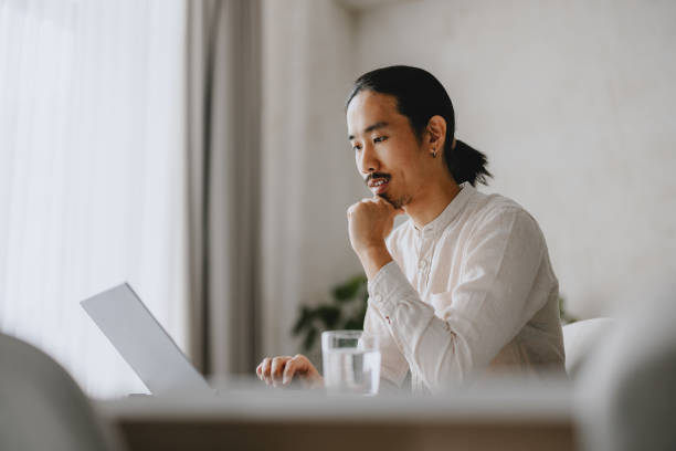 istock Focused Business Professional Working On Laptop In Modern Office 2160994951