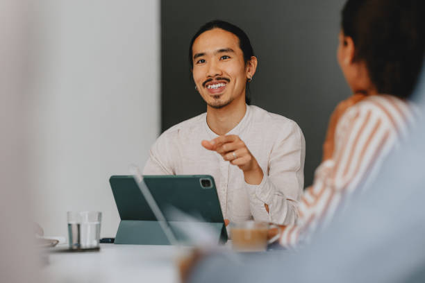istock Confident Business Team Collaborating In Office Meeting 2160994976
