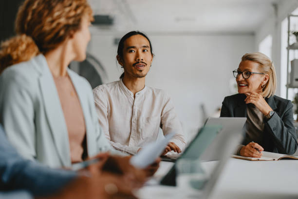 istock Diverse Team Engaged in Exciting Business Meeting at Modern Office 2160995073