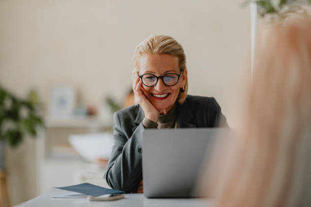 istock Smiling Businesswoman Working on Laptop at Modern Office 2160995100
