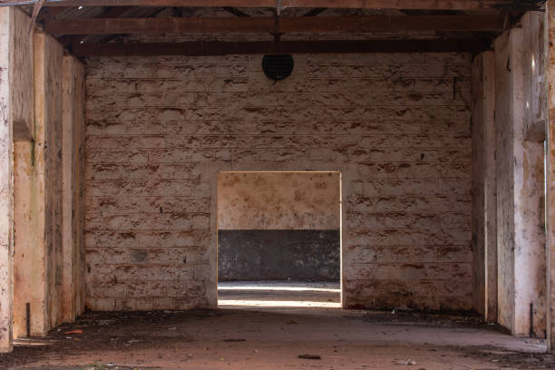 istock old abandoned warehouse illuminated by the sun 2160995661
